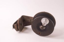 An early 20th century brass centre pin fishing reel