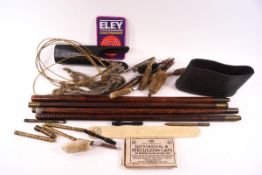 A box of cleaning rods and accessories for shot guns