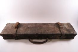 A leather shot gun case and a leather rifle bag
