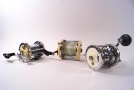 Three various Garcia and Captain Mitchell Multiplier reels