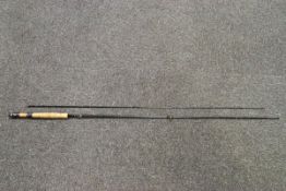 Two split cane fishing rods and a gaff