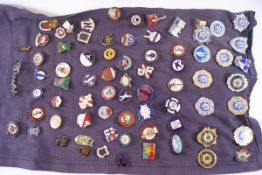 Seventy four football badges,