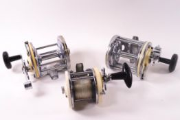 Three various Garcia and Captain Mitchell Multiplier reels