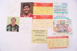 A small quantity of Manchester United ticket stubs, badges,