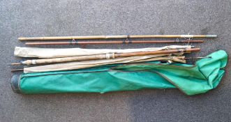 A collection of assorted coarse fishing rods and rests in holdall