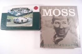 The Authorised Biography of Stirling Moss and a motor sport jigsaw puzzle of a Jaguar XK120,