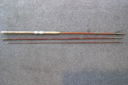 A fibreglass 'Ogden Smith' 12' three piece spinning rod