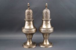 A pair of silver casters each with an acorn finial and of baluster form, 14cm high, Birmingham 1978,