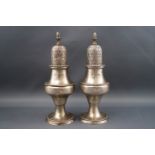 A pair of silver casters each with an acorn finial and of baluster form, 14cm high, Birmingham 1978,