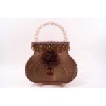 A 1960's handbag lamp with applied trim, beaded drops and handle,
