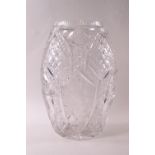 A heavy cut glass vase of flattened oval form, each side with a rose design,