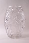 A heavy cut glass vase of flattened oval form, each side with a rose design,