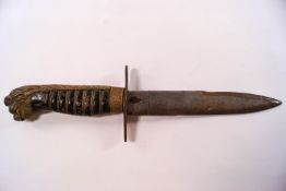 An Austrian dagger with wire bound wooden grip and brass lion's head