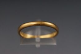 A 22ct gold wedding band, size O 3.6 grams.