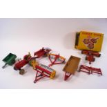 A collection of Dinky die-cast farm vehicles and equipment, comprising: 323 Triple Gang Mower,