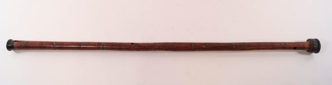 A walking cane in the form of a flute,