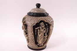 A Chinese marble jar and cover, the body carved in heavy relief of four figures,