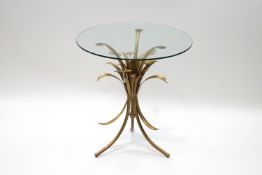 A 1950's French occasional table, gold painted metal base modelled as plants,