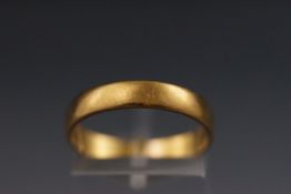 A 22ct gold wedding band, Size Q, 3.5 grams.