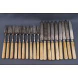 A set of George III silver and ivory handled tea knives and forks,