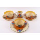 A Clarice Cliff Bizarre part breakfast set in the Crocus pattern, comprising two cup and saucers,