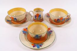 A Clarice Cliff Bizarre part breakfast set in the Crocus pattern, comprising two cup and saucers,