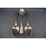 Three silver fiddle pattern serving spoons, one with a monogram, various dates and makers,