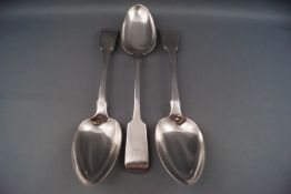Three silver fiddle pattern serving spoons, one with a monogram, various dates and makers,