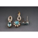 Two yellow metal blue zircon and cubic zirconia pendants togteher with a pair of single stone blue