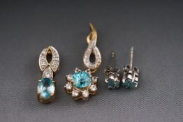 Two yellow metal blue zircon and cubic zirconia pendants togteher with a pair of single stone blue