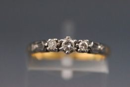 A yellow and white metal three stone diamond ring Approx 0.20ct stamped 18ct plat size: M 2.