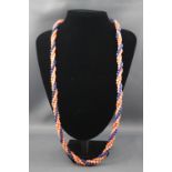 A multi strand twisted coral and sodalite bead necklace with goldplated clasp. 89.