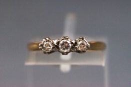 An early 20th century gold and diamond three stone ring,
