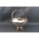 A silver pedestal basket, the octagonal bowl on a round foot and with a pierced handle,