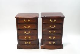 A pair of mahogany bow front bedside chests of drawers,