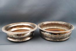 A pair of silver plated sauce boats with double "C" scroll handles and shell and hoof feet,