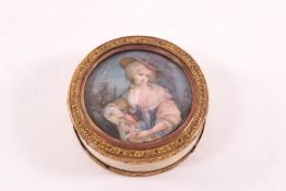 An 18th century circular ivory box with gilt metal mounts,
