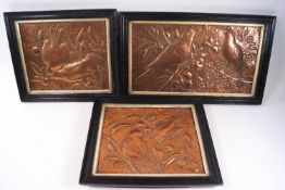 Three Victorian Aesthetic copper panels depicting birds eating fruit among the trees,