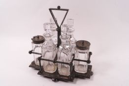 A Hukin and Heath silver plated cruet set, possibly a Christopher Dresser design,