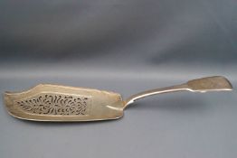 A William IV silver fiddle pattern fish slice, the handle engaved with a lion crest, London 1836,
