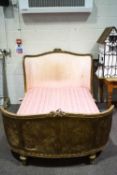 An early 20th century French giltwood and cane double bed,