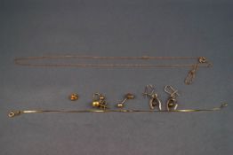 A gold assortment to include earrings, bracelet and a chain as a mix of 9ct, 14ct and 18ct gold.