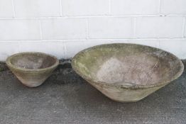 A large re-constituted stone planter of conical form, 31cm high x 90cm diameter,