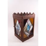 An early 20th century copper and stained glass hall lantern,