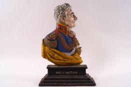 A painted cast iron door stop, modelled as the Duke of Wellington, 23.