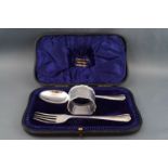 A silver Christening fork, spoon and napkin ring, Sheffield 1909 by Atkin Bros, 98g,