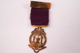 A 9ct gold Masonic medal, presented to 'Comp. J. Crank M.E.