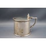 A Victorian silver mustard pot of cylindrical form with double scroll thumb rest,