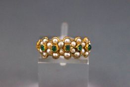 An early Victorian gold, emerald and half-pearl multi-flower-head cluster ring,