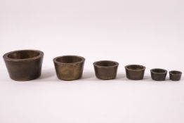 A set of six Victorian Troy cup weights,
